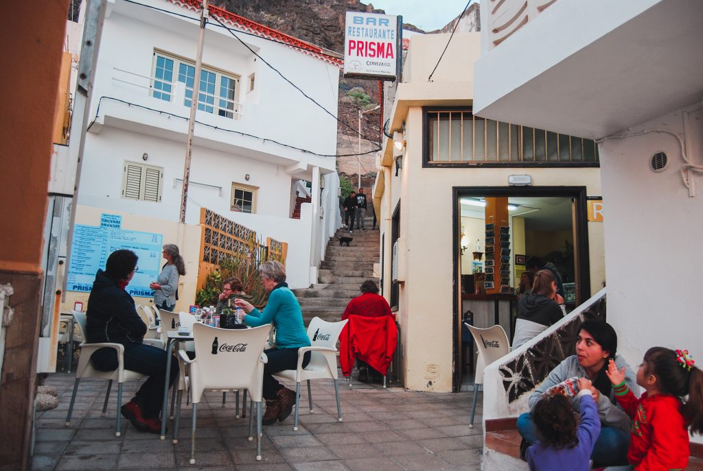 People eating at the restaurants outdoor seating.